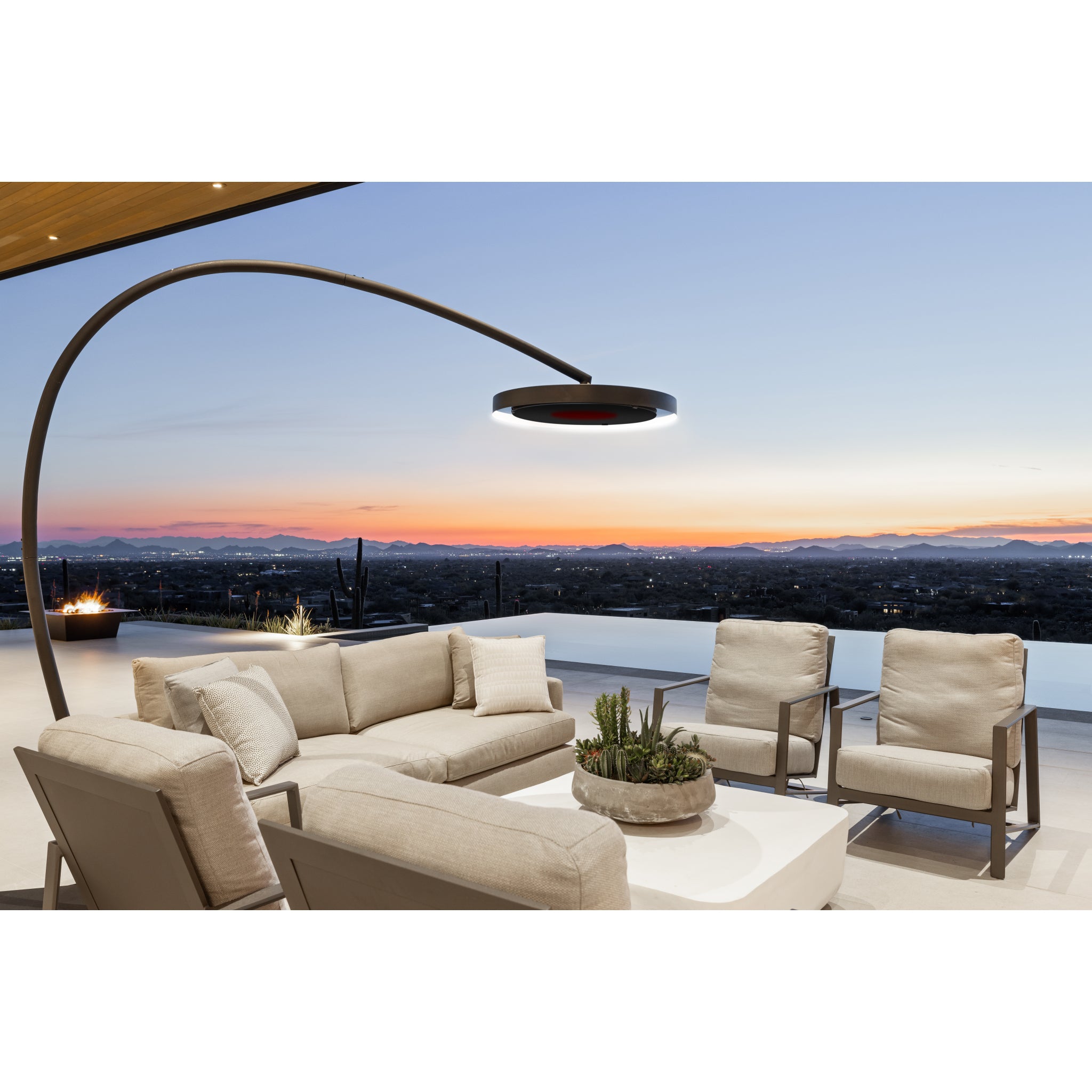Bromic Eclipse Smart-Heat Electric heater on outdoor patio set with a scenic view of a sunset over a cityscape.