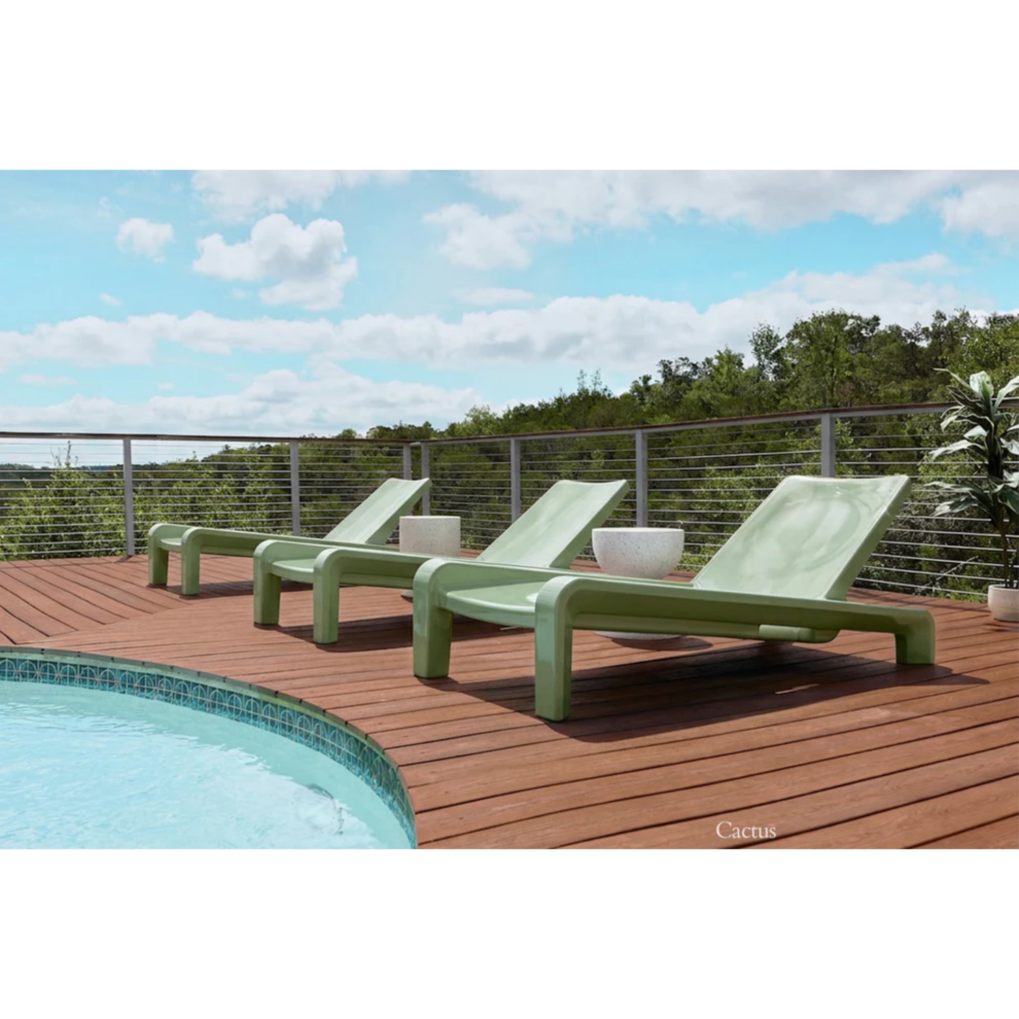 Cactus green outdoor chaise lounges creating premium poolside seating on a modern tanning ledge