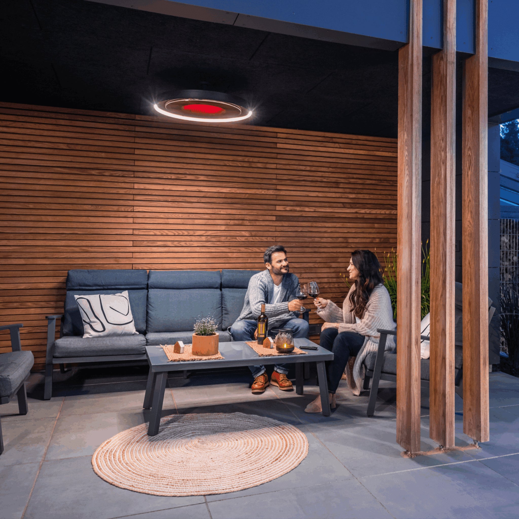 Bromic Eclipse Smart-Heat Electric outdoor heater installed with pole mount in covered patio setting