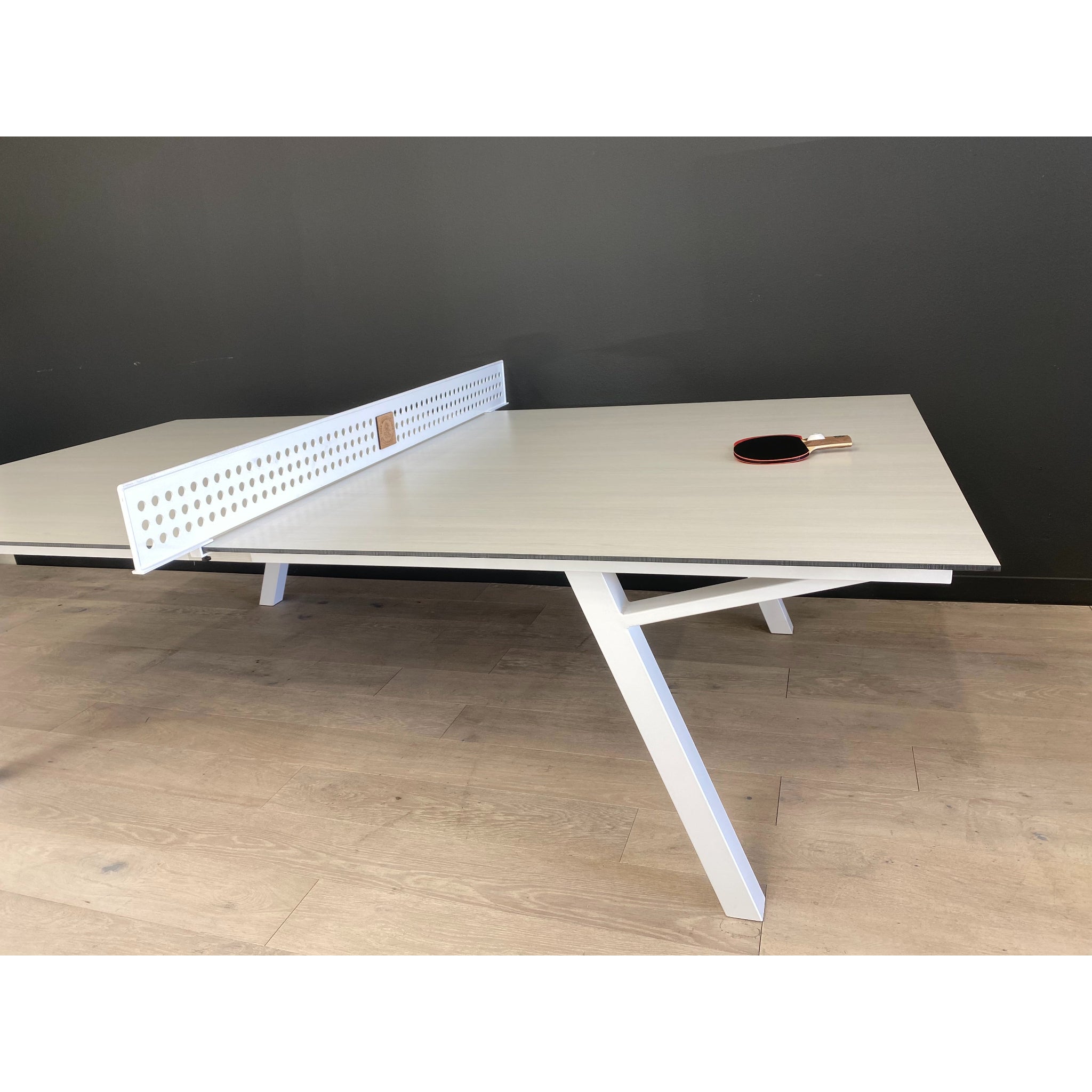 Custom outdoor ping pong table by Sean Woolsey featuring architectural metal design, ideal for interior designers and luxury hospitality installations