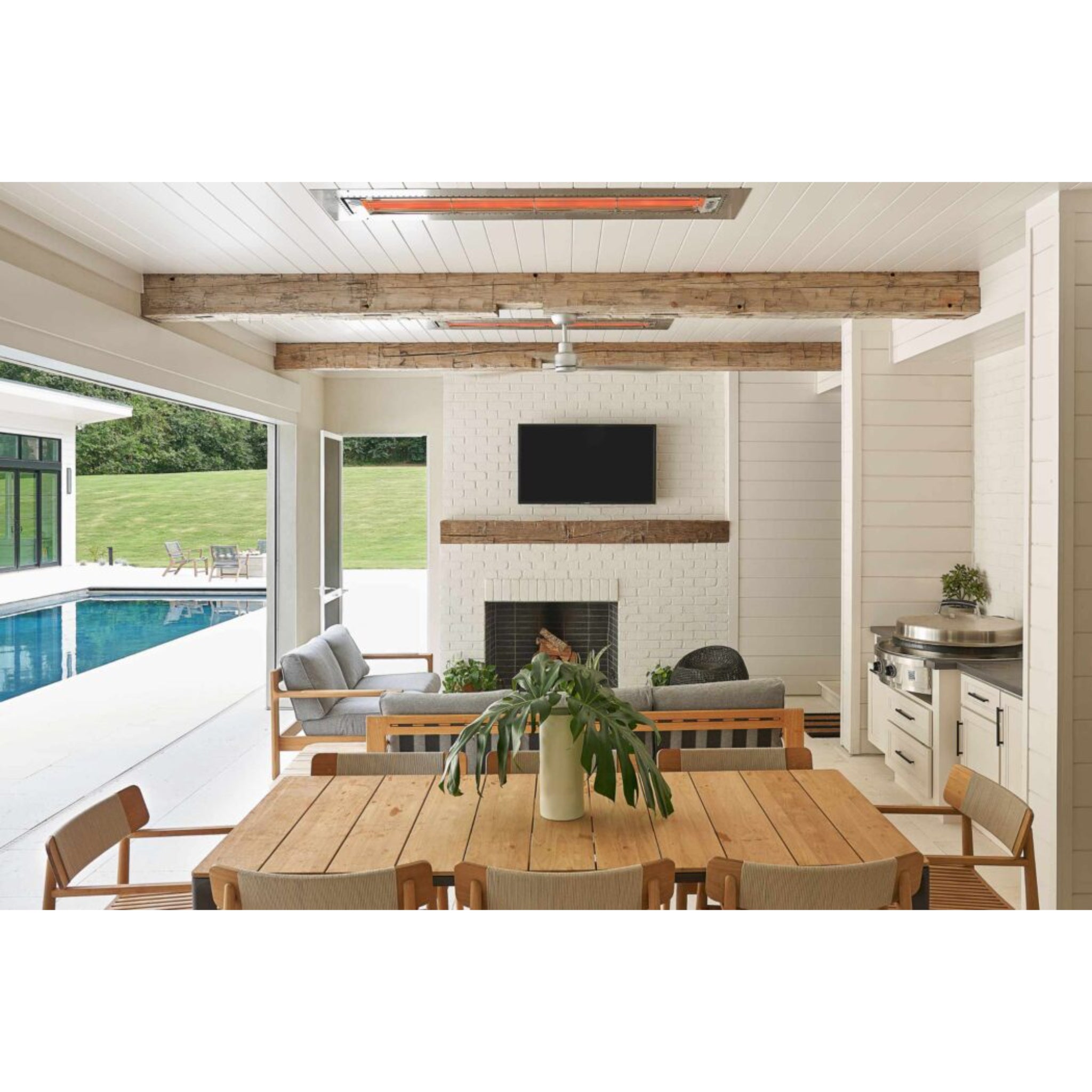Infratech W Series infrared patio heater mounted on a ceiling beam in a resort-style outdoor living area