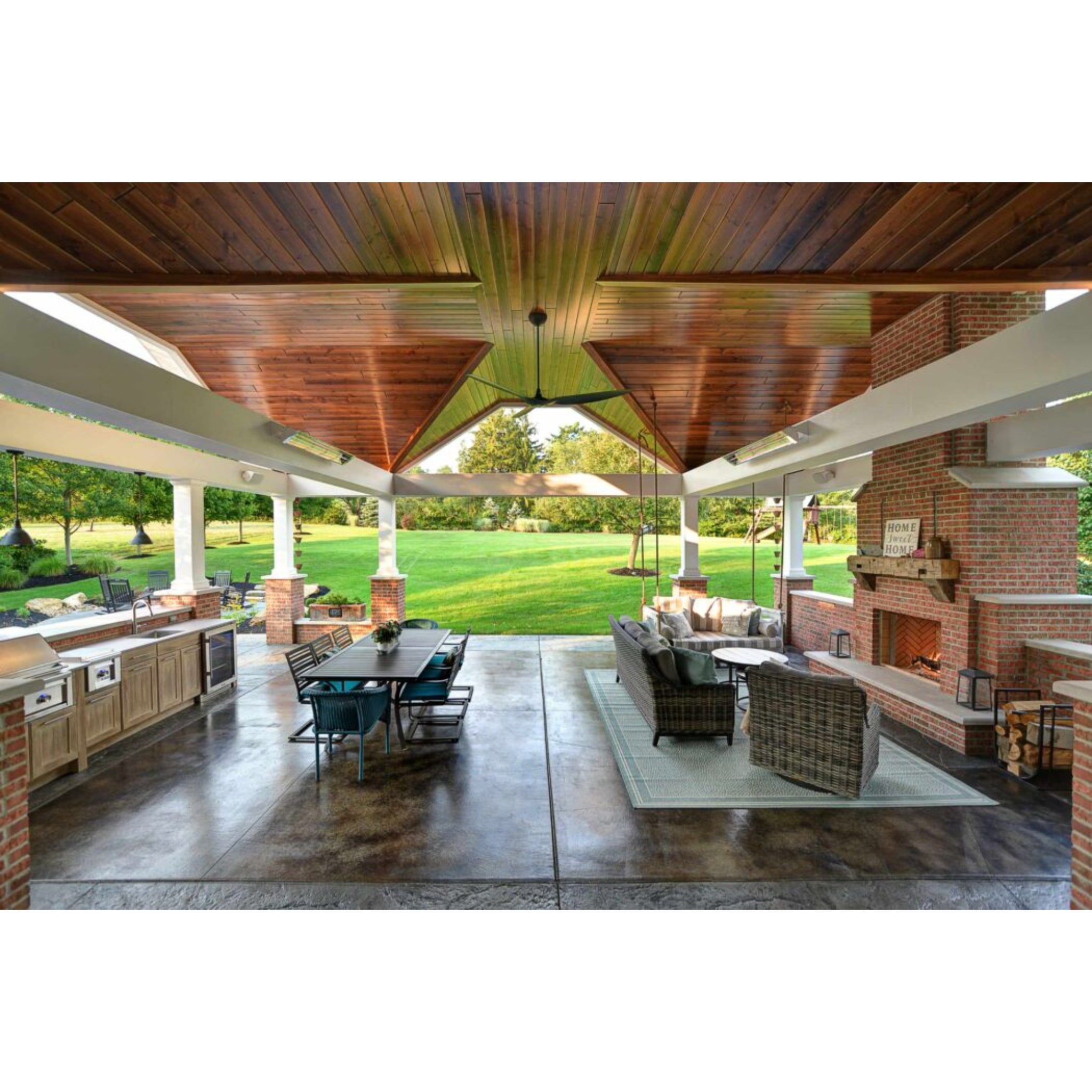 Infratech W Series infrared heater providing directional warmth over an outdoor dining table and seating area