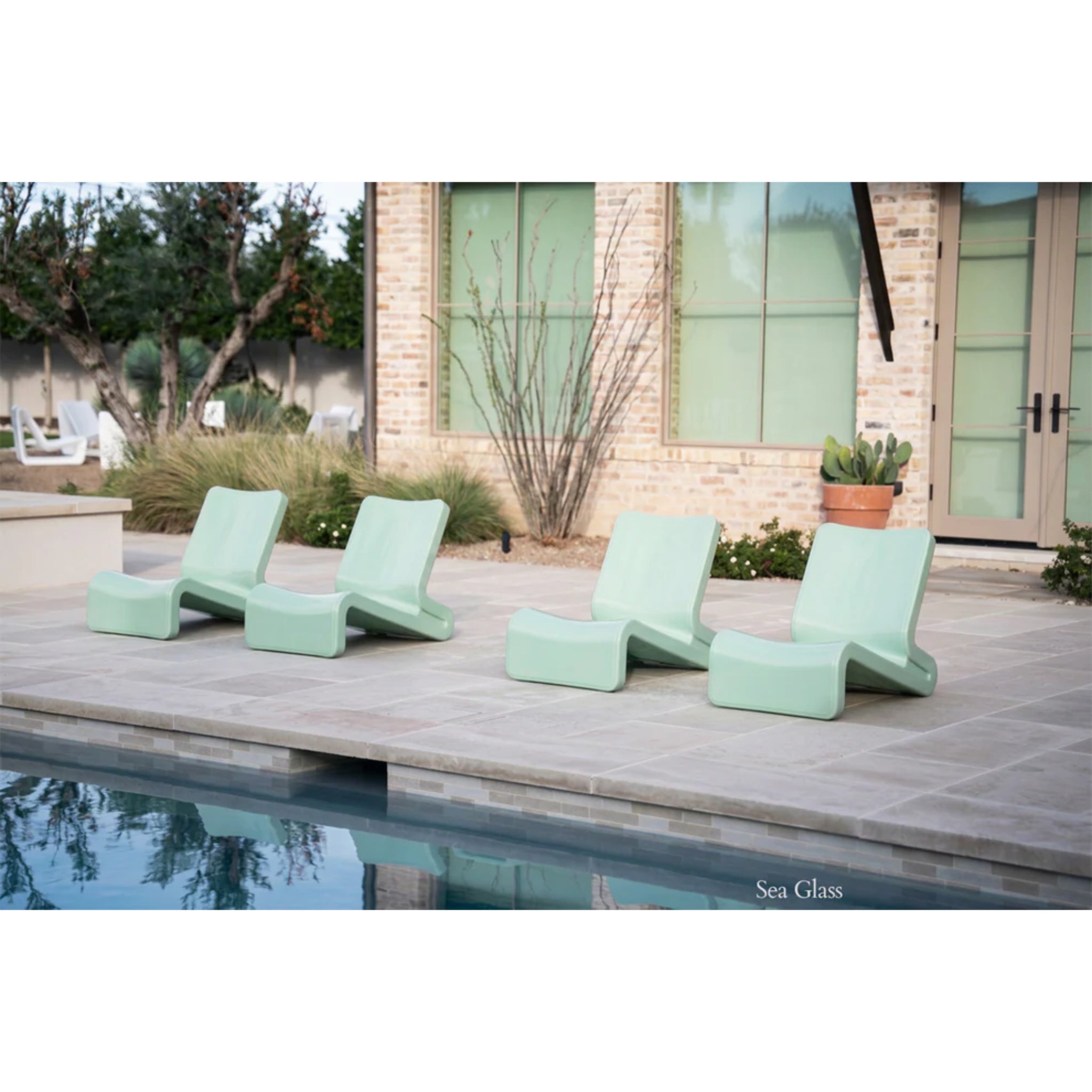 Line Lounge Chair by Tupelo in Seaglass color used on patio or for in-pool lounger