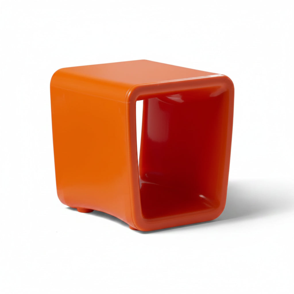 Loop Table in Vintage orange by tupelo is a cube-shaped stool for in-pool lounging