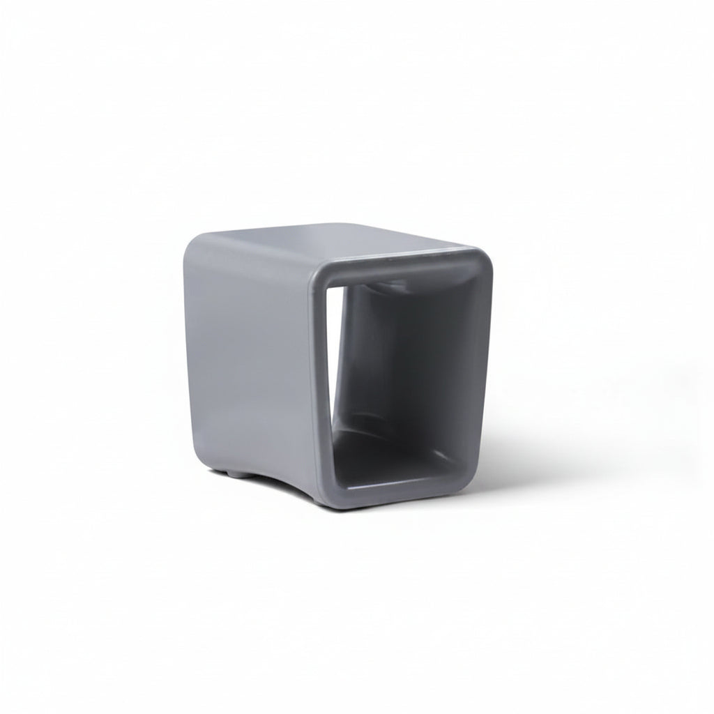Gray cube-shaped stool on a white background