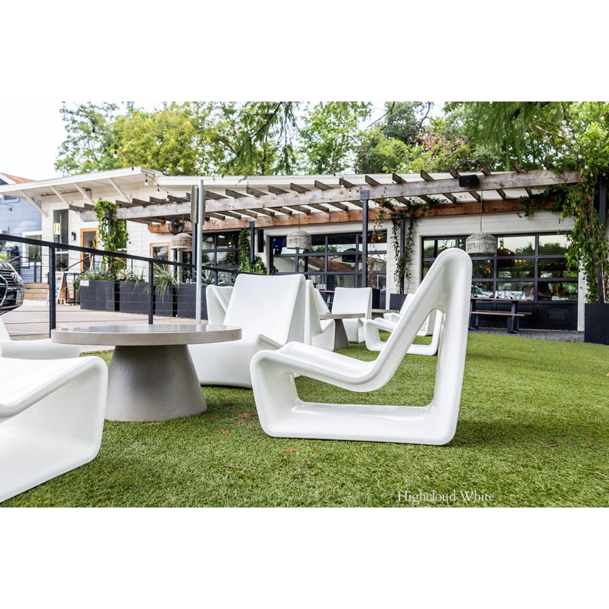 Luxury white pool chair enhancing a resort-style backyard with premium outdoor seating