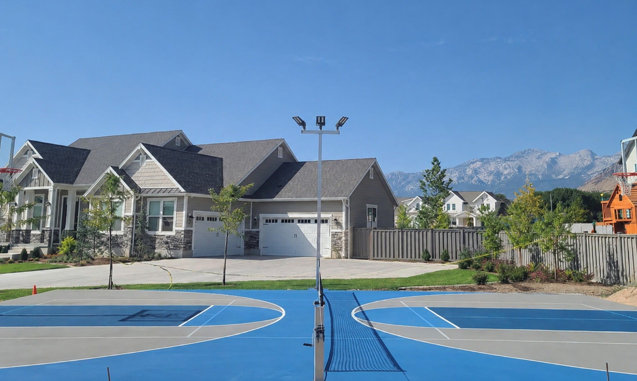 Sport court light with 3 light fixtures on sport court at luxury home and short term rental