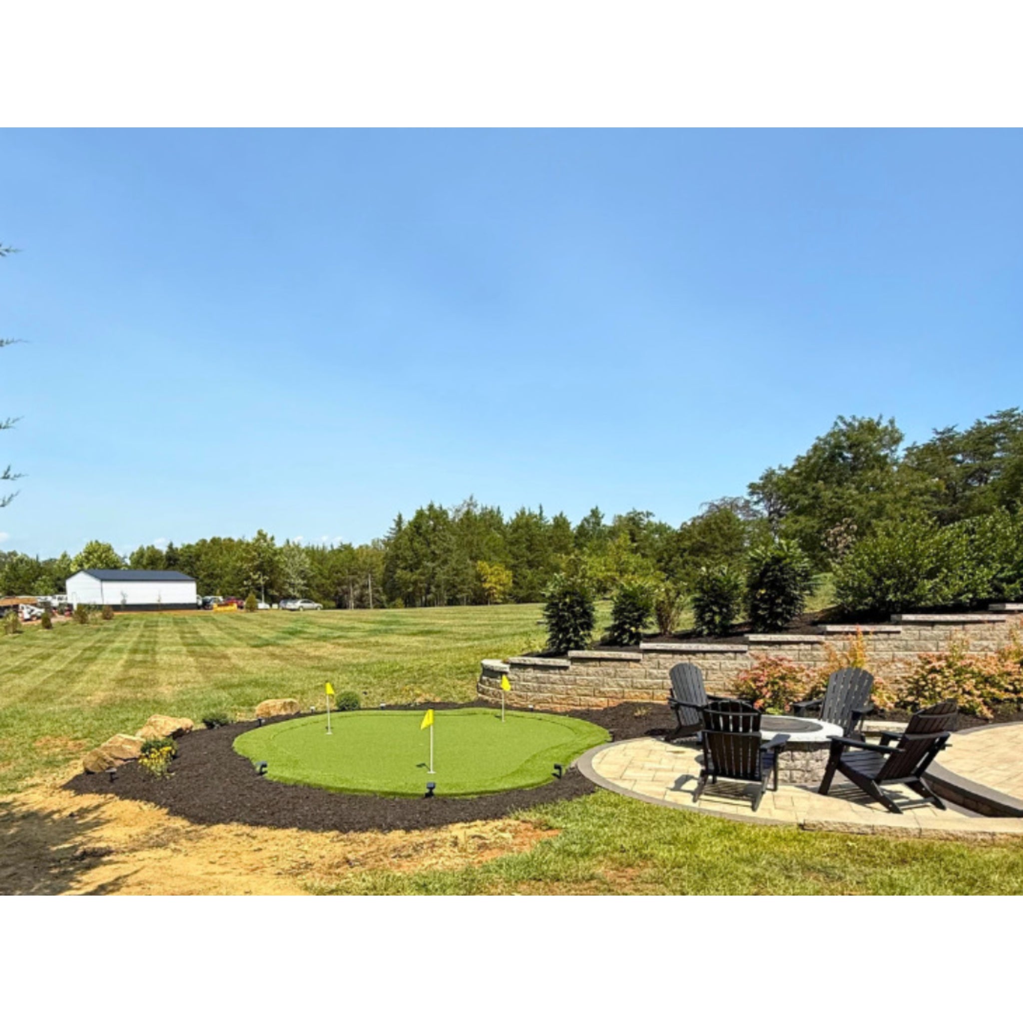 The Kiawah Outdoor Putting Green, DIY Kit 15 feet by 17 feet, 255 sq. ft. backyard installation by open space and fire pit.