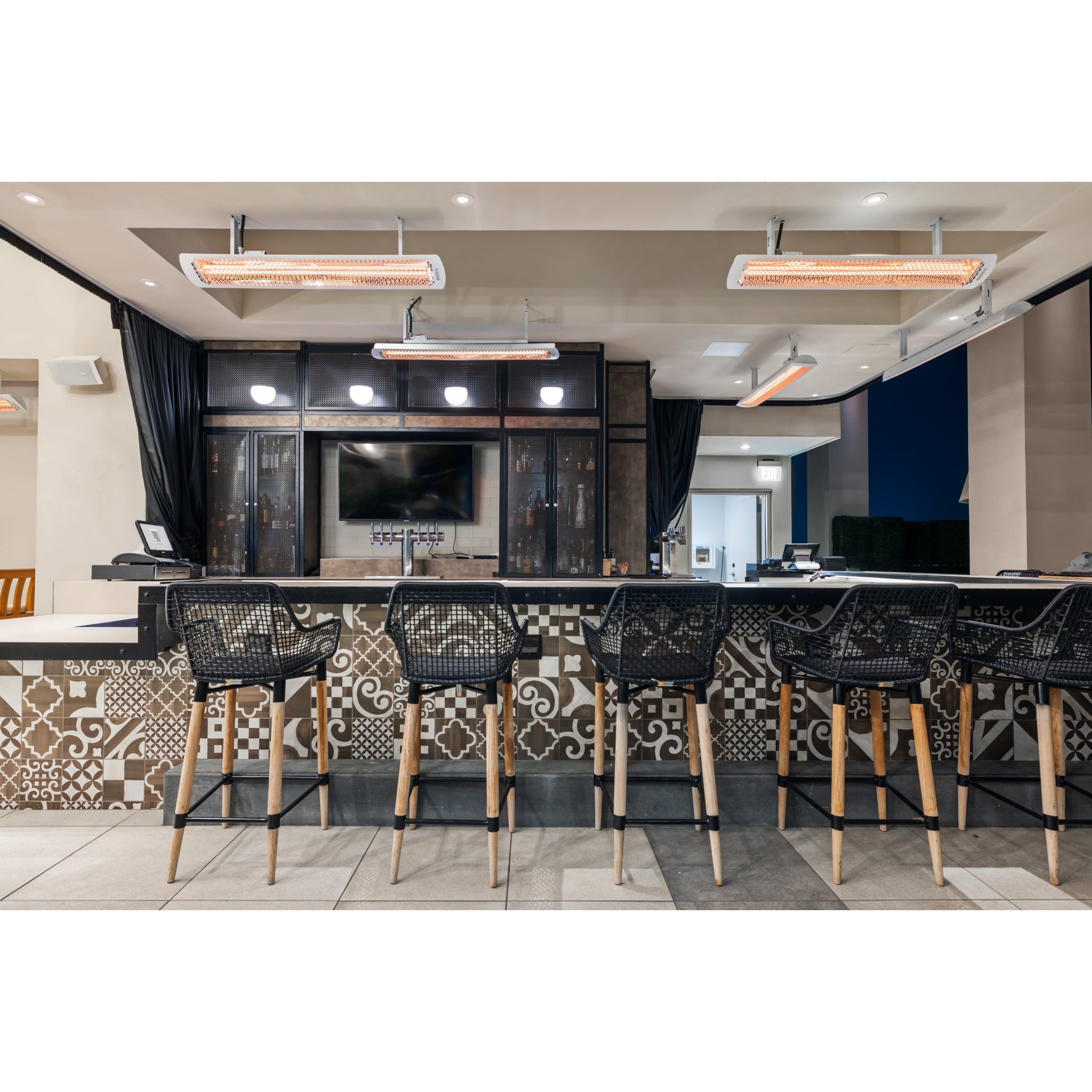 Outdoor electric patio heater from the Bromic Tungsten Smart-Heat series installed at restaurant bar