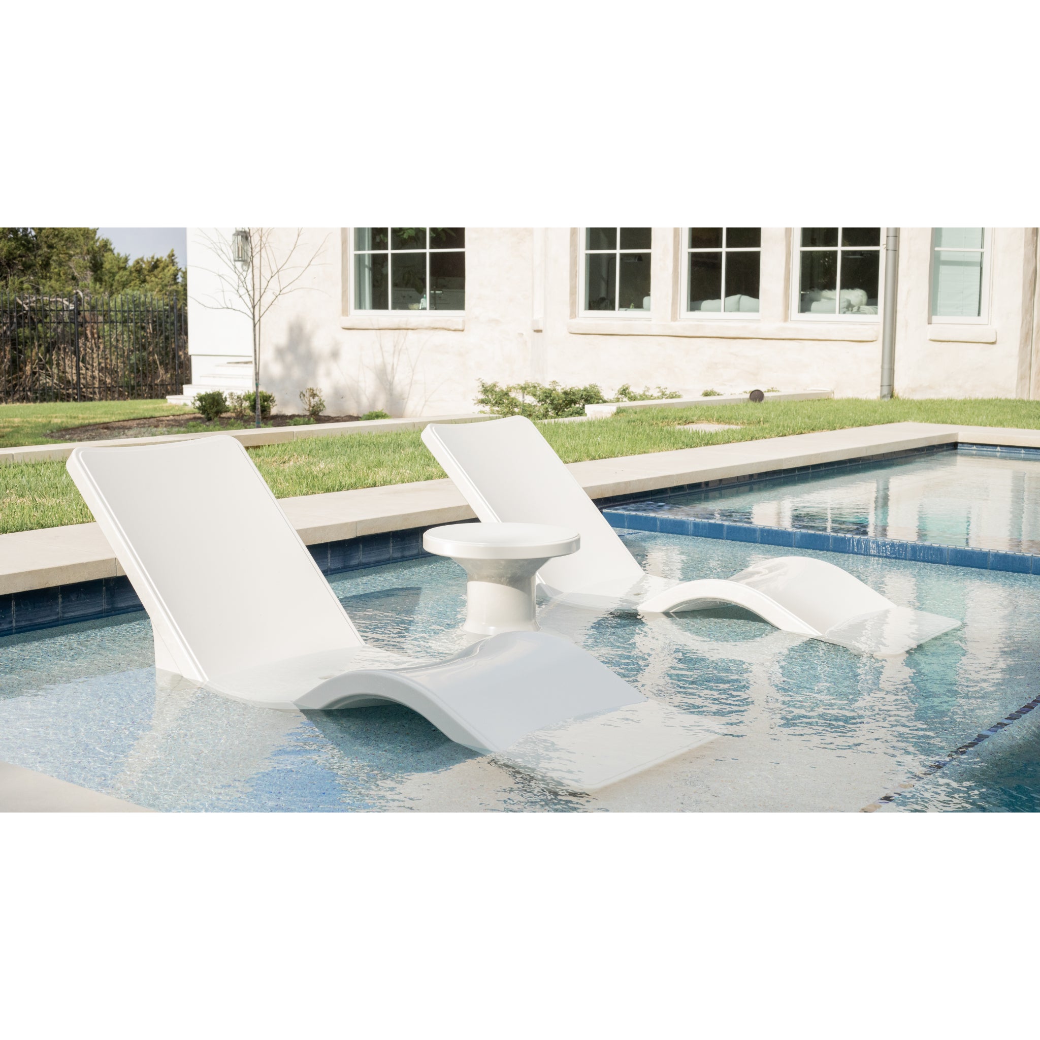 Sculptural pool chaise lounge alternative to traditional ledge loungers