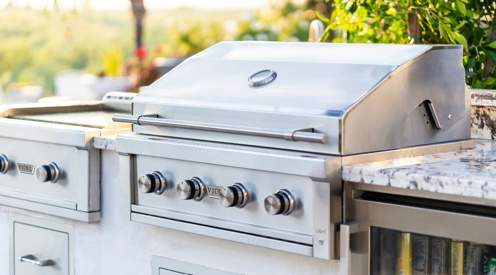 Luxury outdoor kitchen with built-in grill and premium cooking appliances