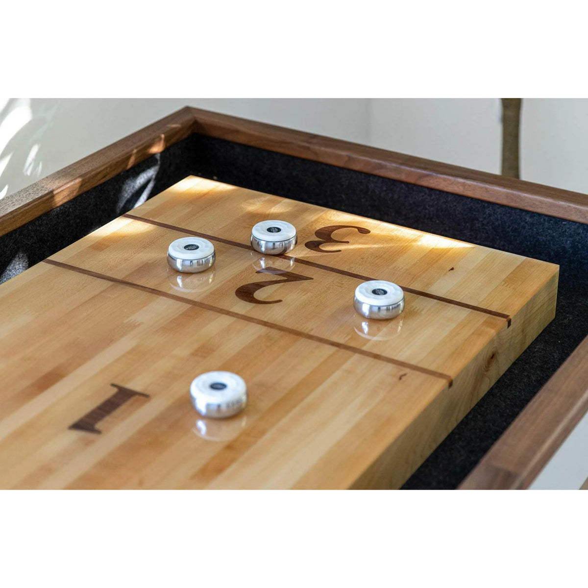 Modern shuffleboard table with wood legs and powder coated steel base