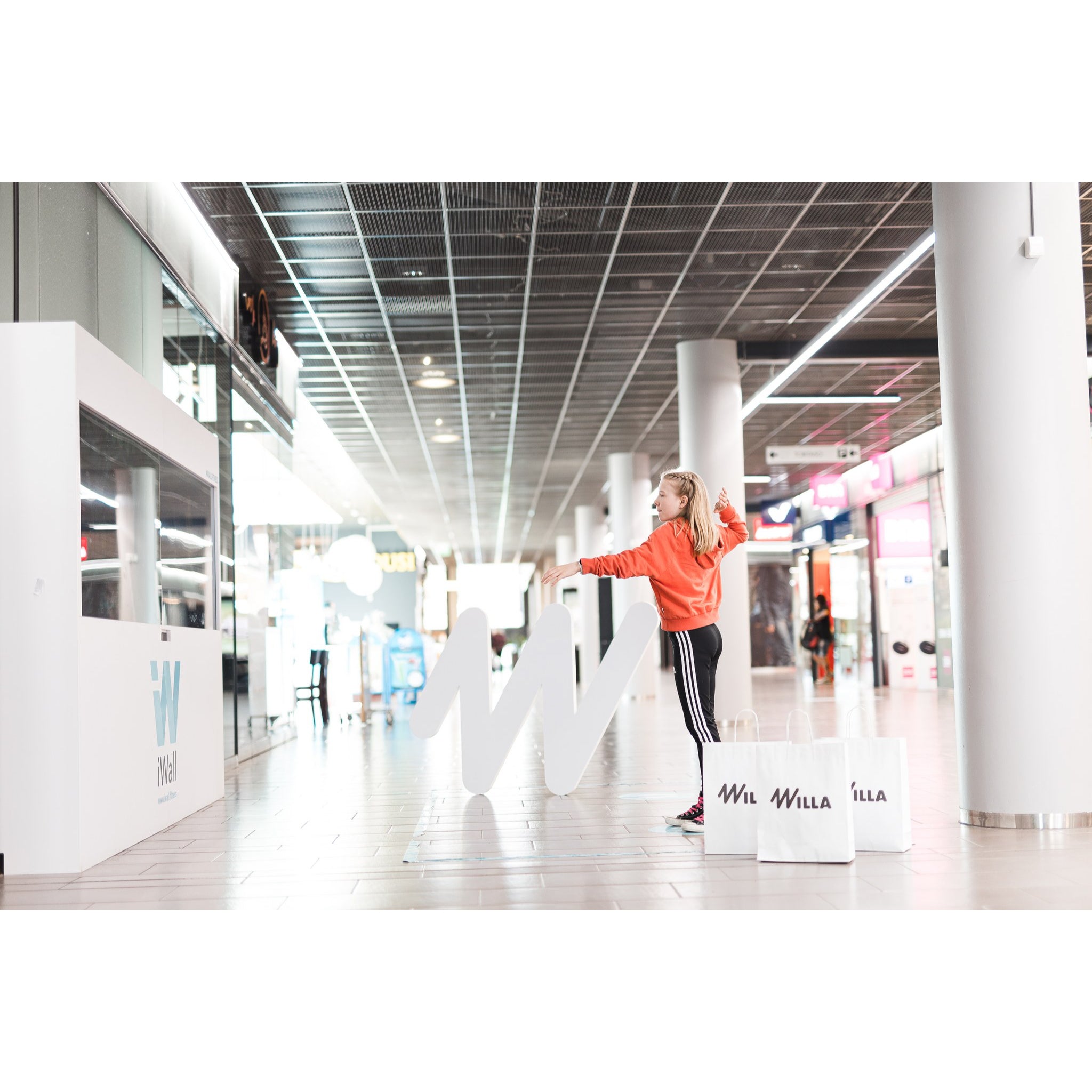 Touch-free interactive fitness wall system for commercial spaces