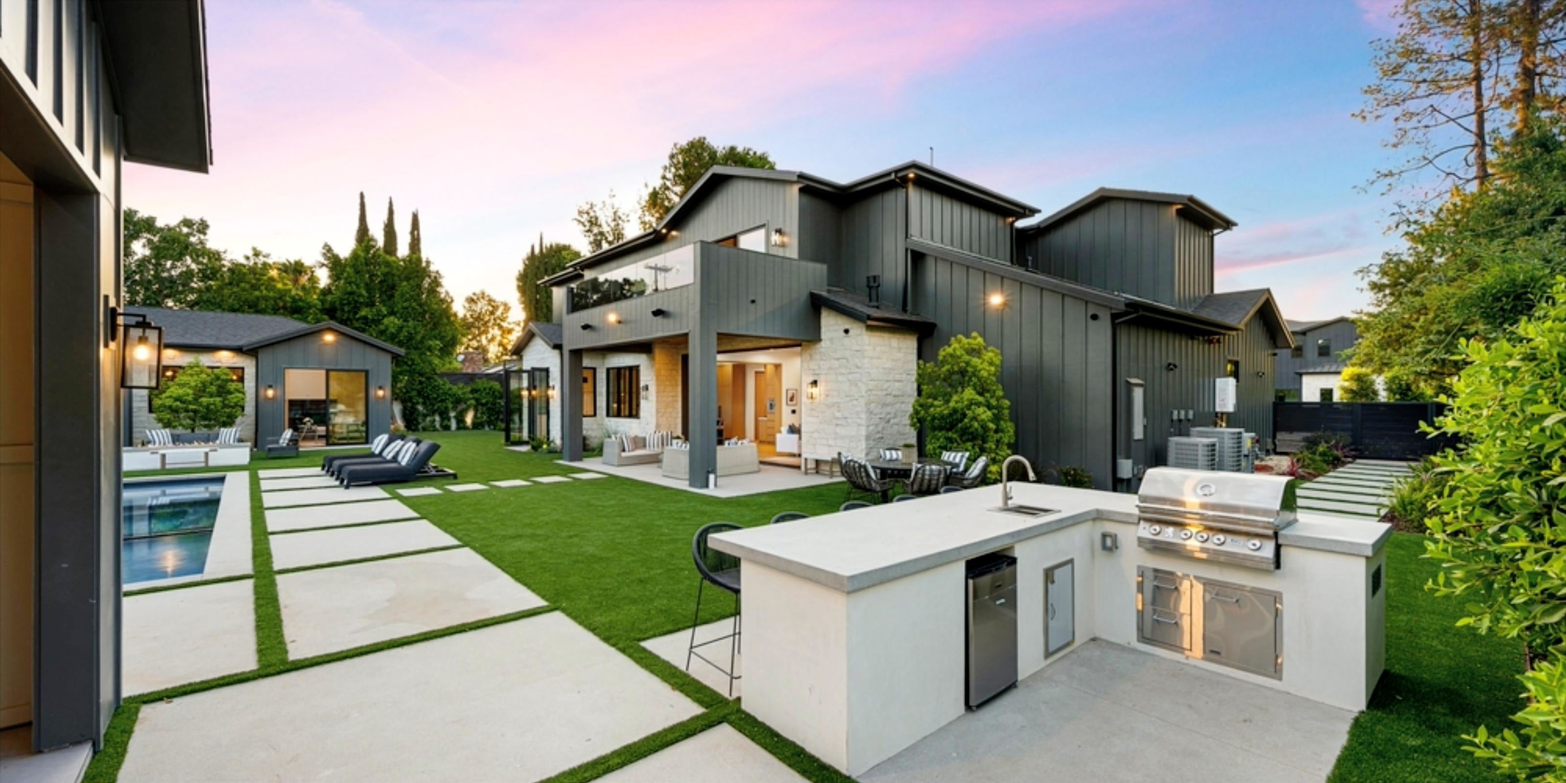 The Tournament House backyard with outdoor grill and pool