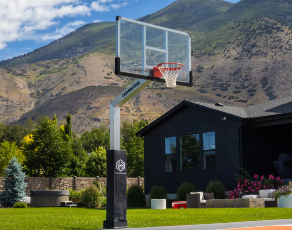 Professional-grade basketball hoop installed on a luxury residential sport court