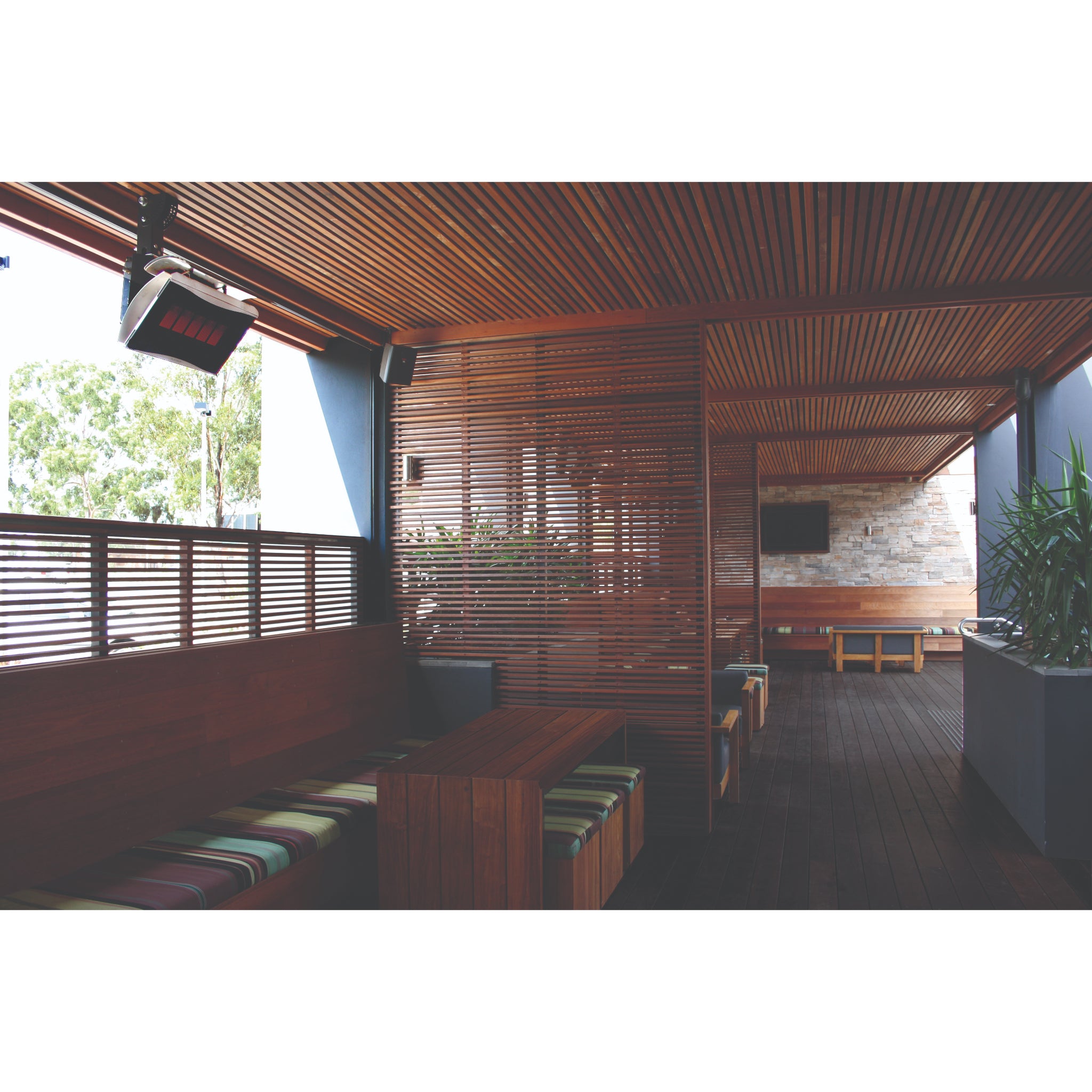 Bromic Platinum outdoor gas heater mounted on ceiling of restaurant.