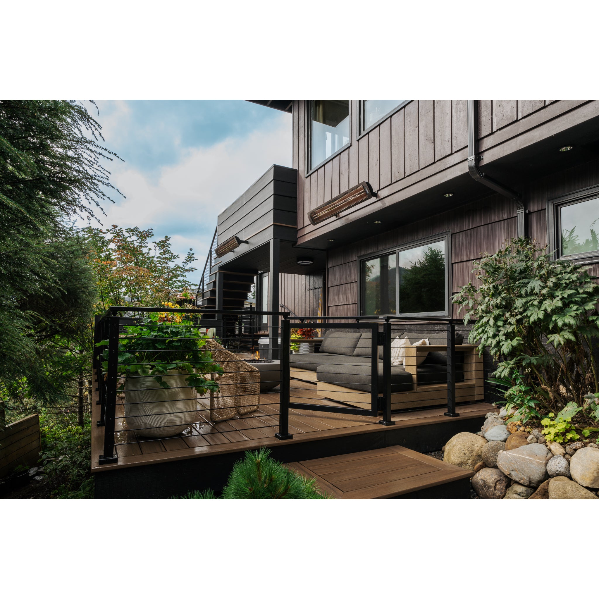 Outdoor electric patio heater from the Bromic Tungsten Smart-Heat series installed on patio of residential luxury home