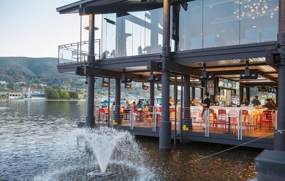 Luxury outdoor dining and entertainment space featuring premium infrared patio heaters