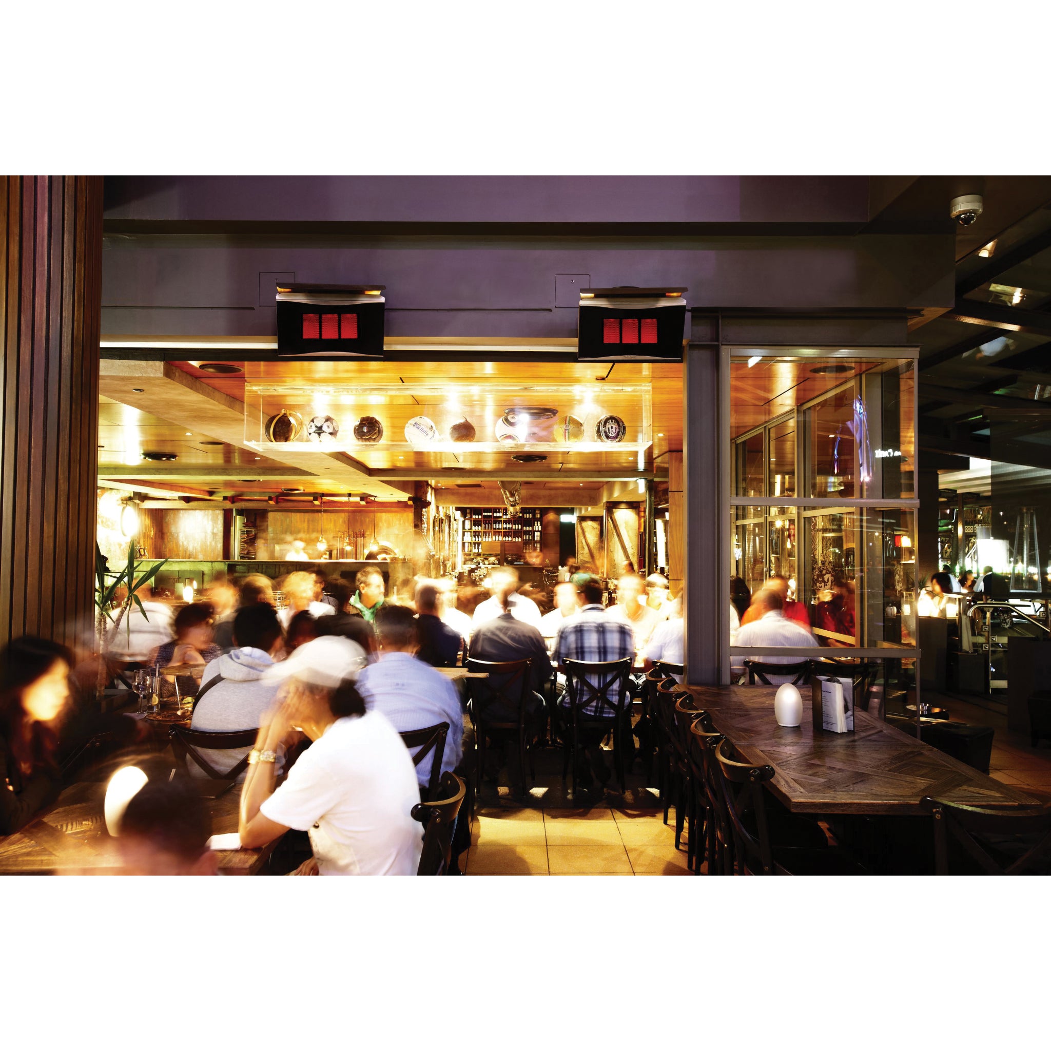 Bromic Platinum Smart-Heat gas outdoor heater mounted on patio wall with ceramic glass fascia