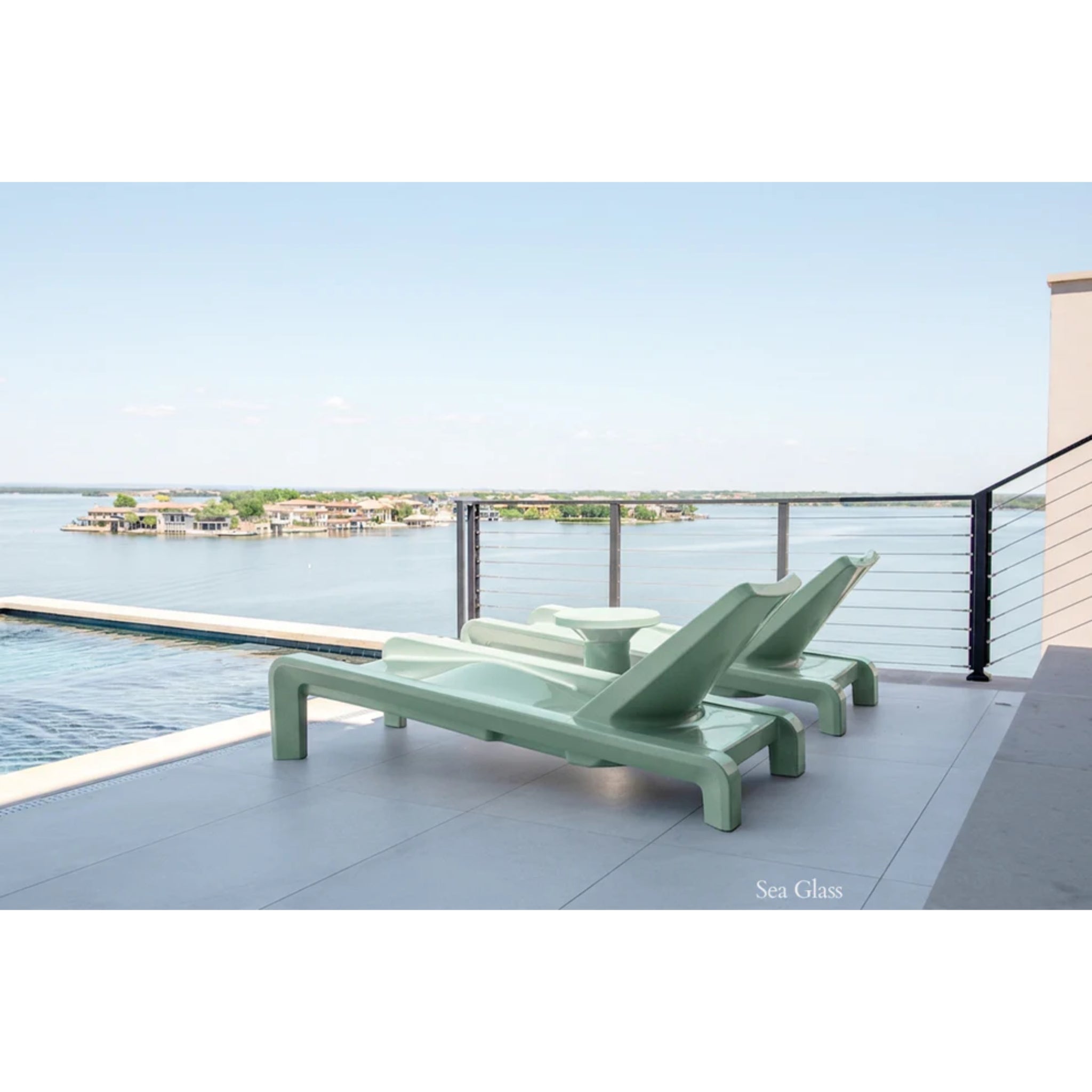 Sea Glass outdoor chaise lounges designed for relaxation on a luxury baja shelf overlooking the pool and deck