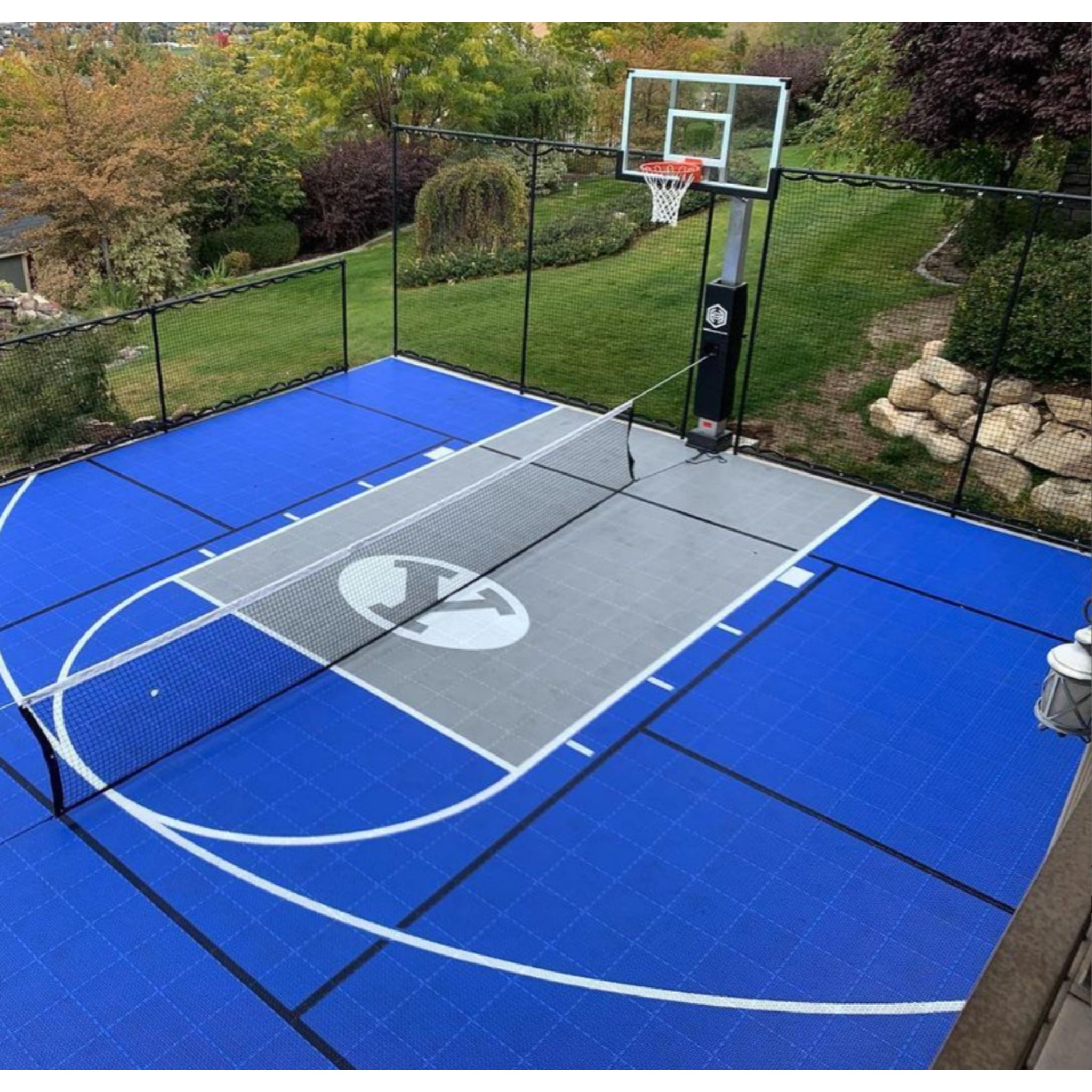 Dominator 60 inch outdoor basketball hoop tempered glass backboard front view on sport court