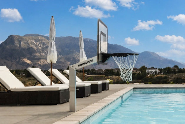Dominator poolside basketball hoop installed on pool deck of hotel