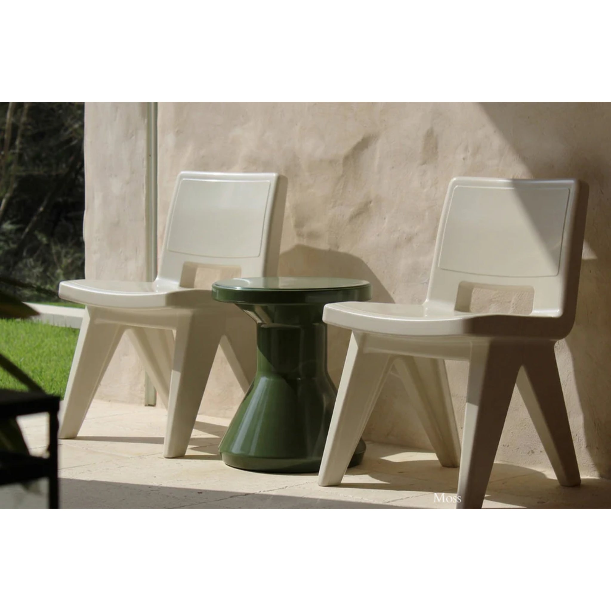 Tupelo Fluent Side Table in Moss green beside luxury in-pool lounge furniture on a resort-style baja shelf patio
