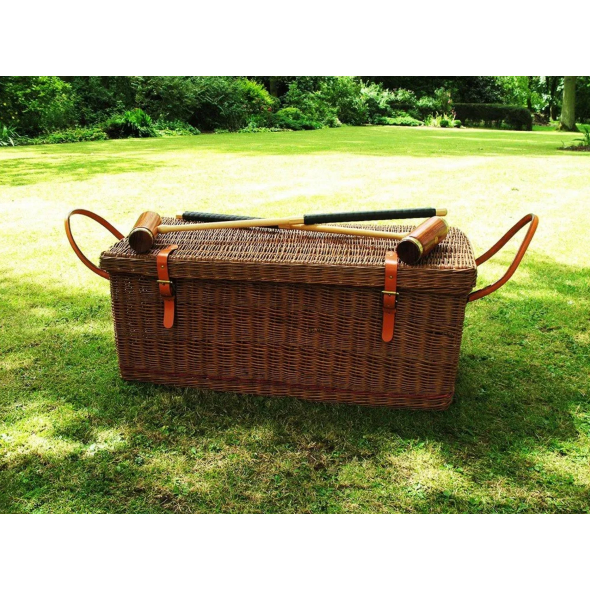 Handcrafted croquet set stored in English willow basket for outdoor entertaining