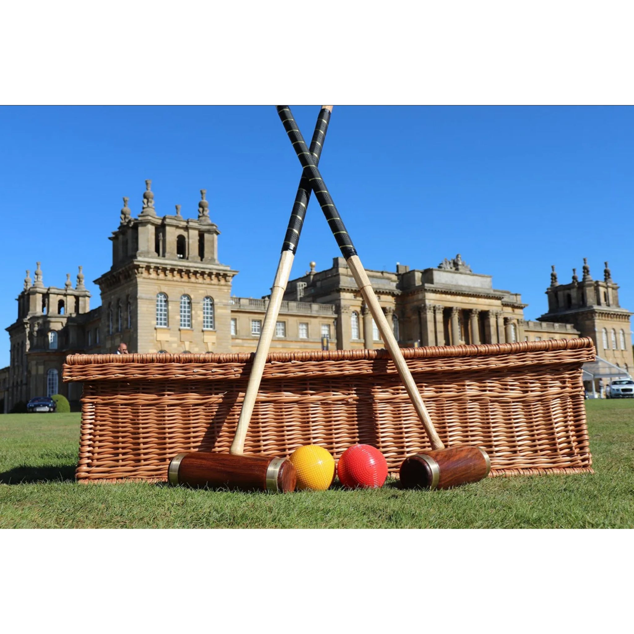 Parker Collection croquet mallets, balls, and cast iron hoops arranged on lawn