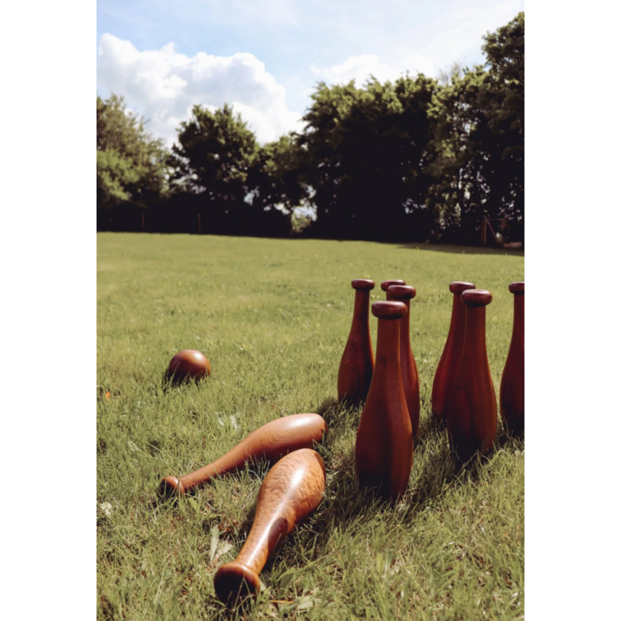 Garden skittles lawn bowling set displayed on manicured grass