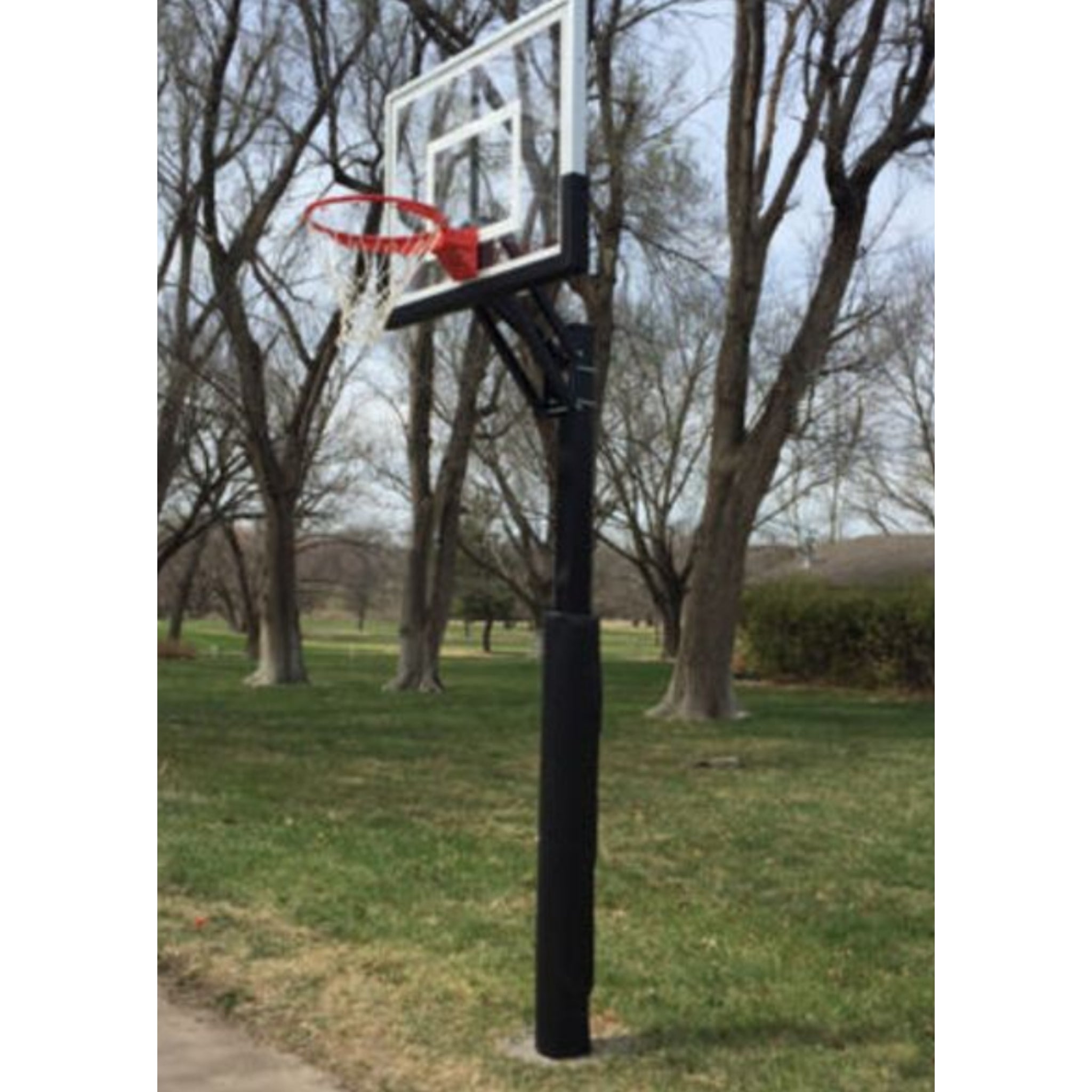 First Team Champ in-ground basketball hoop installed on residential court