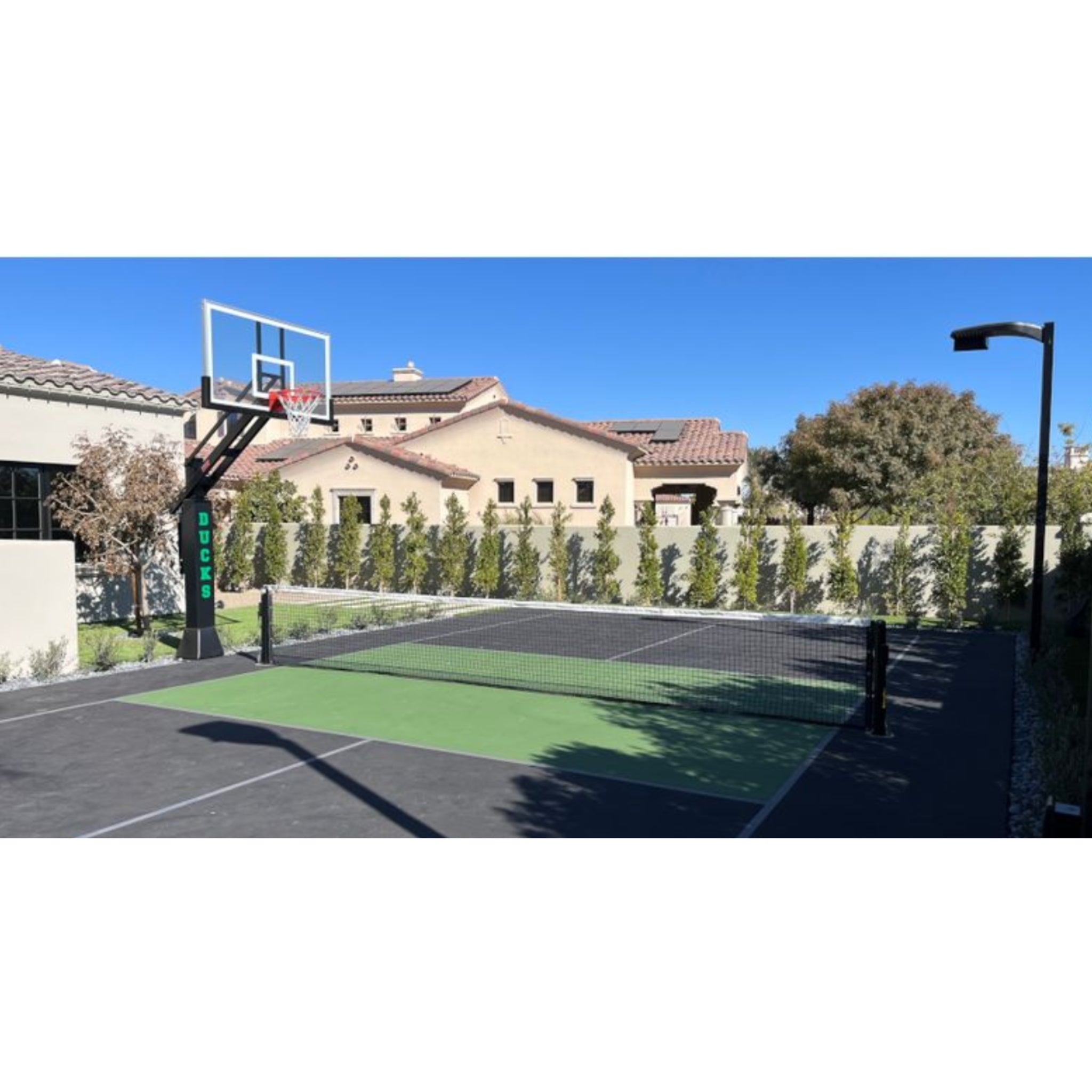 Guardian pickleball net and post system with aluminum posts on outdoor court