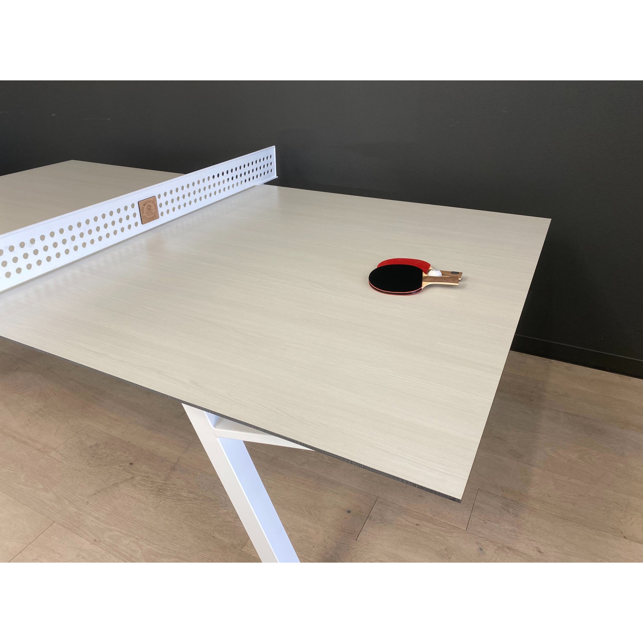 Modern outdoor ping pong table setup with Sean Woolsey table, premium table tennis for luxury backyard entertainment and STR investment properties