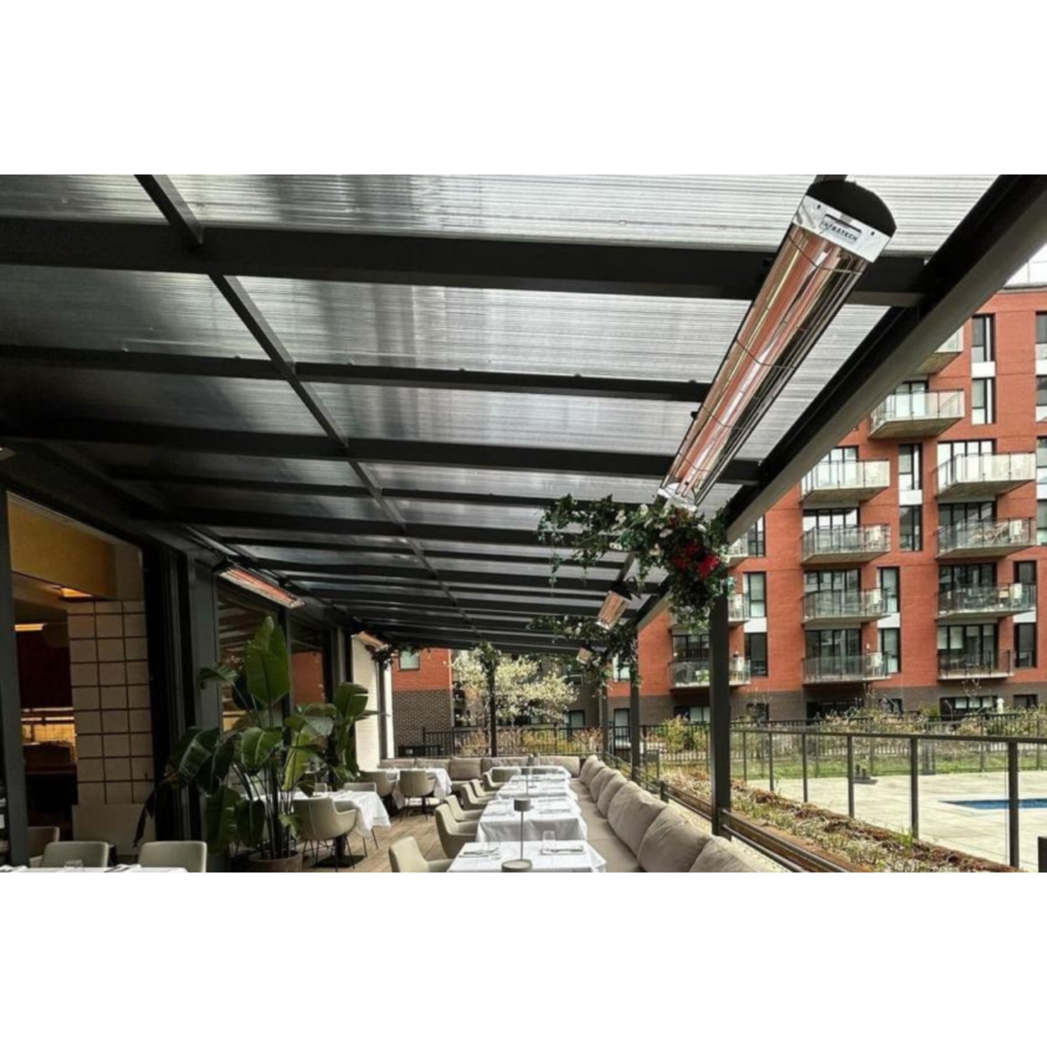 Infratech CD series dual element  infrared electric patio heater in black finish installed at restaurant patio