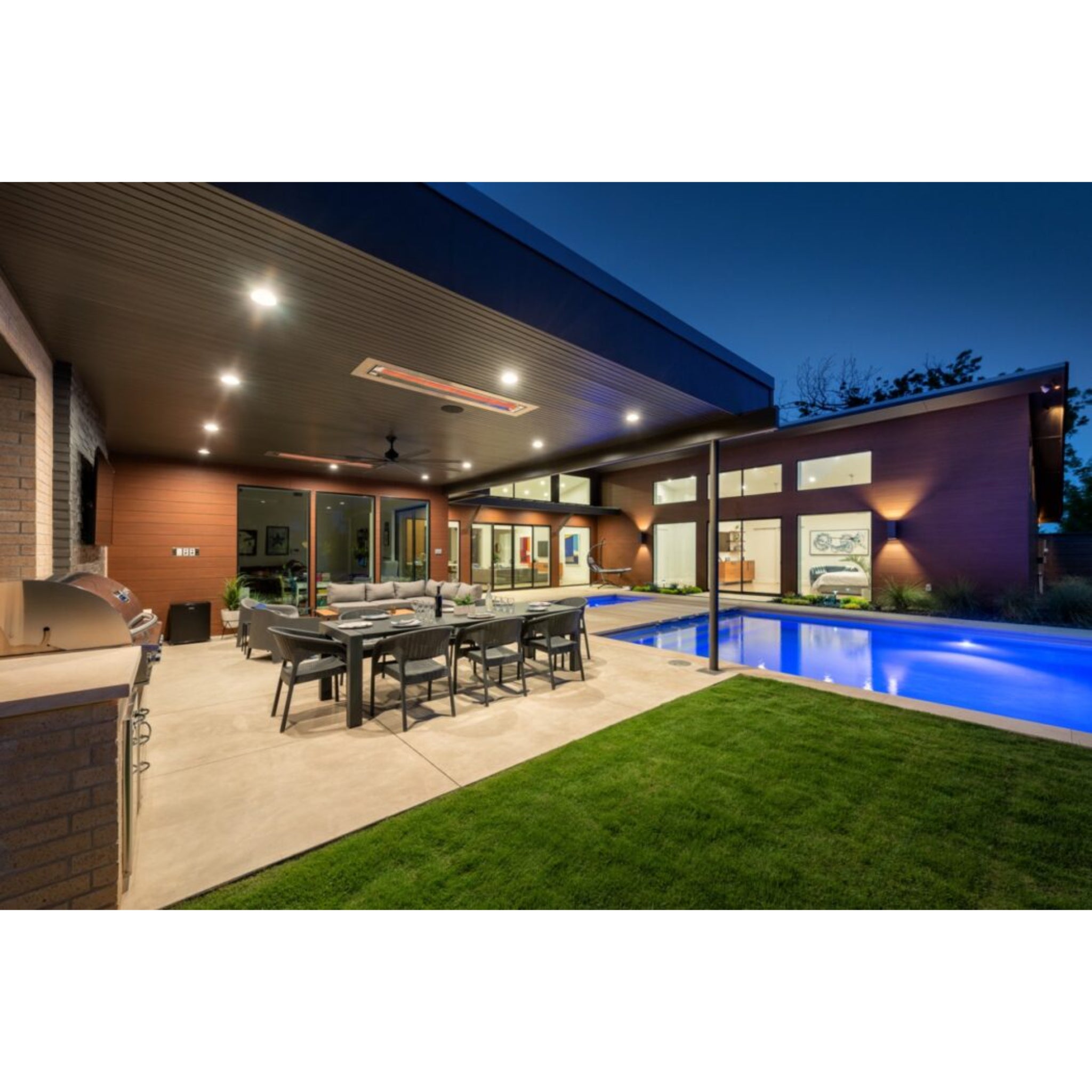 Infratech WD Series dual element infrared heater warming a covered veranda at dusk