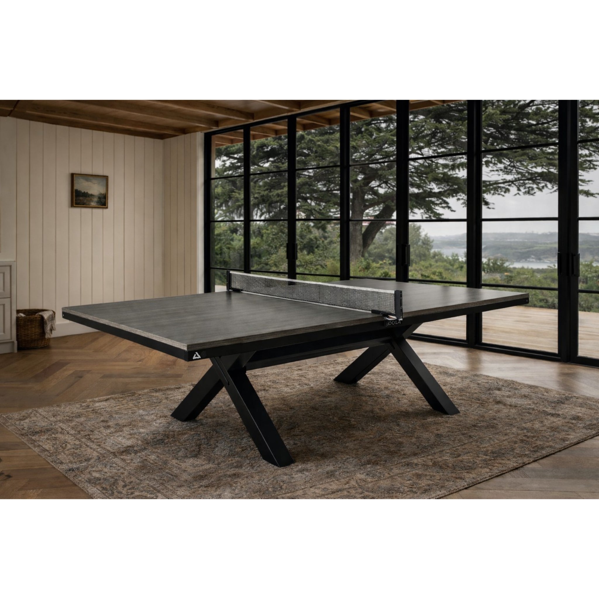 JOOLA Brighton Indoor Tennis Table in great room area that can be used as ping pong table or dining table
