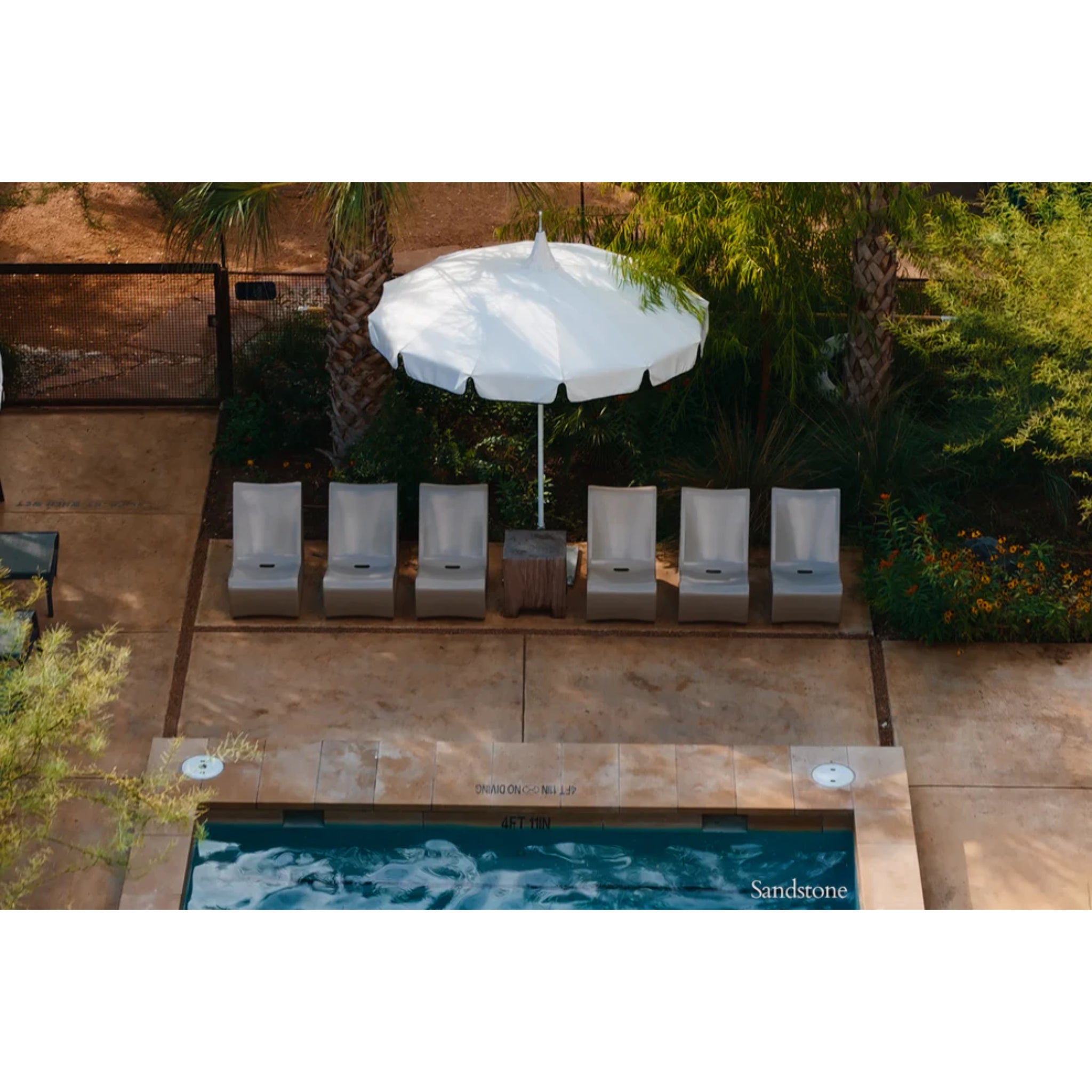 Sandstone outdoor pool chair designed for luxury resort-style outdoor living and relaxation