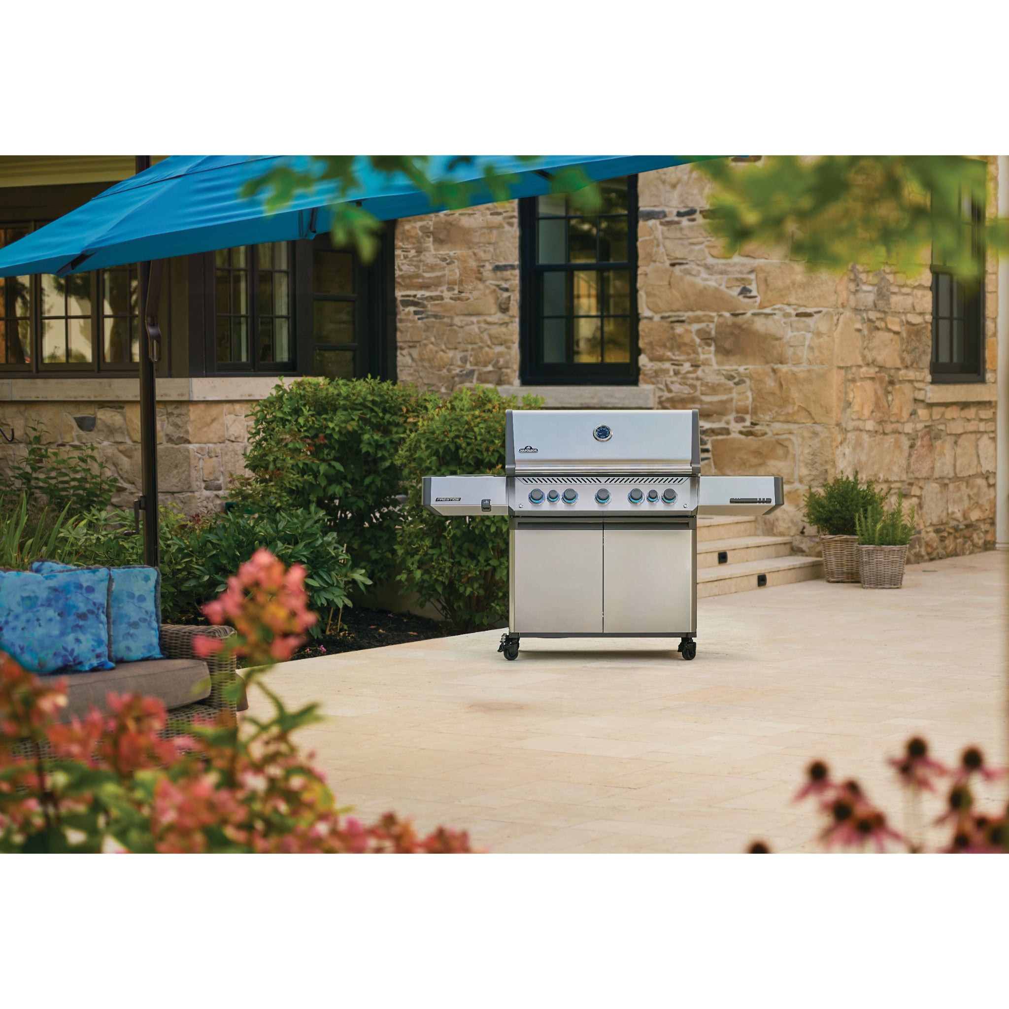 Napoleon Prestige 665 gas grill with infrared side burner and rear rotisserie burner installed on patio