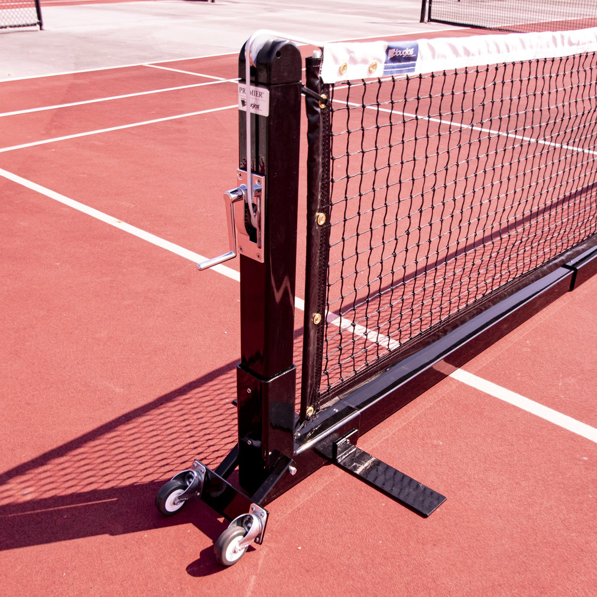 Professional Douglas portable pickleball net with caster wheel transport system