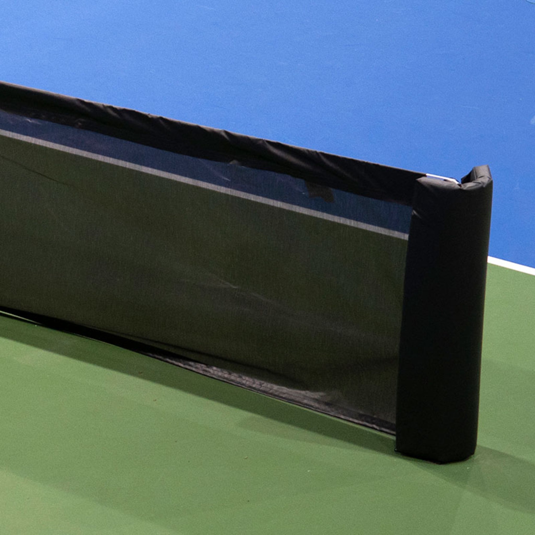 Surface mount pickleball court divider system for indoor pickleball clubs