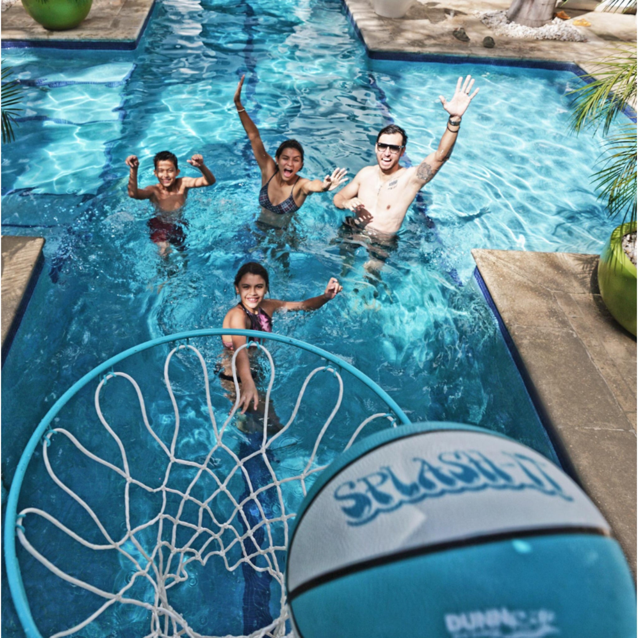 Splash & Shoot pool basketball hoop in use during pool play with family