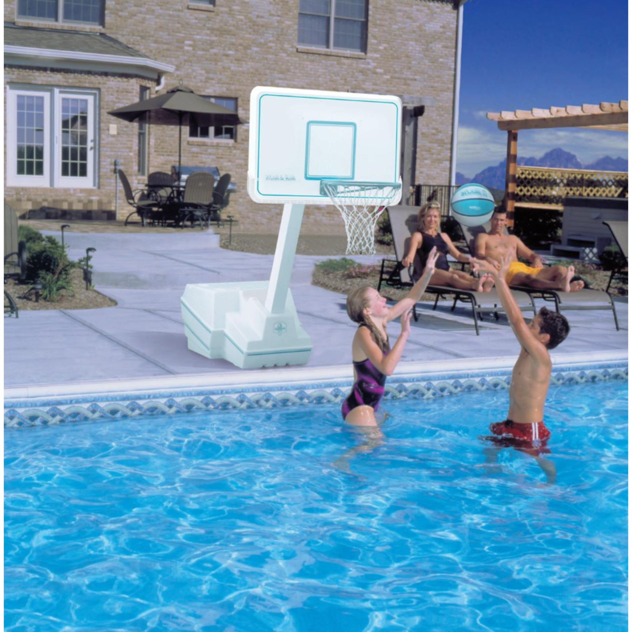 White backboard pool basketball hoop by Dunn-Rite with adjustable height rim at residential pool