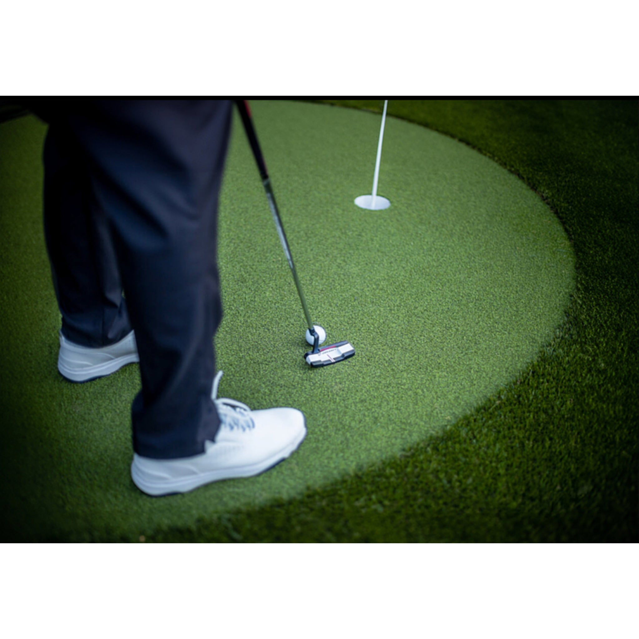 Close up of Ultra Base turf on outdoor backyard putting green.
