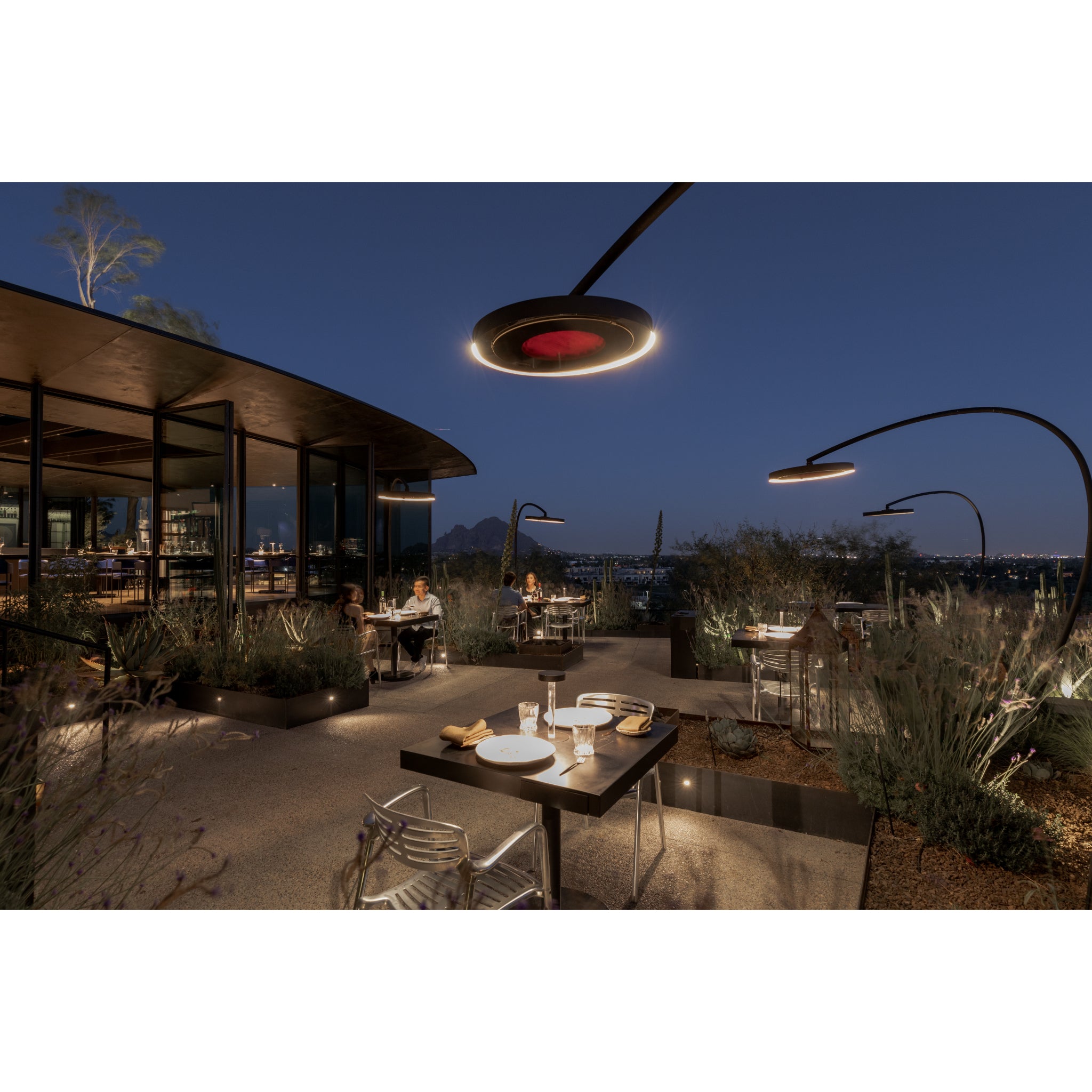 Evening outdoor dining scene with Bromic Eclipse Portable patio heater for outdoor restaurant in Scottsdale