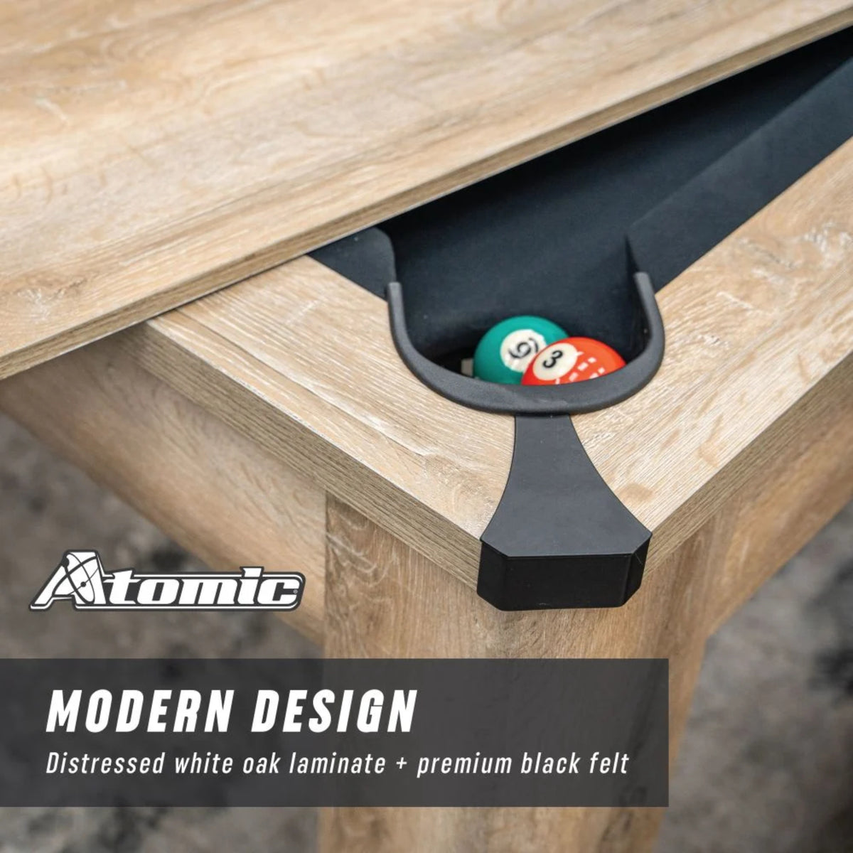 Close-up of Atomic Hampton billiard table corner pocket with distressed white oak laminate finish