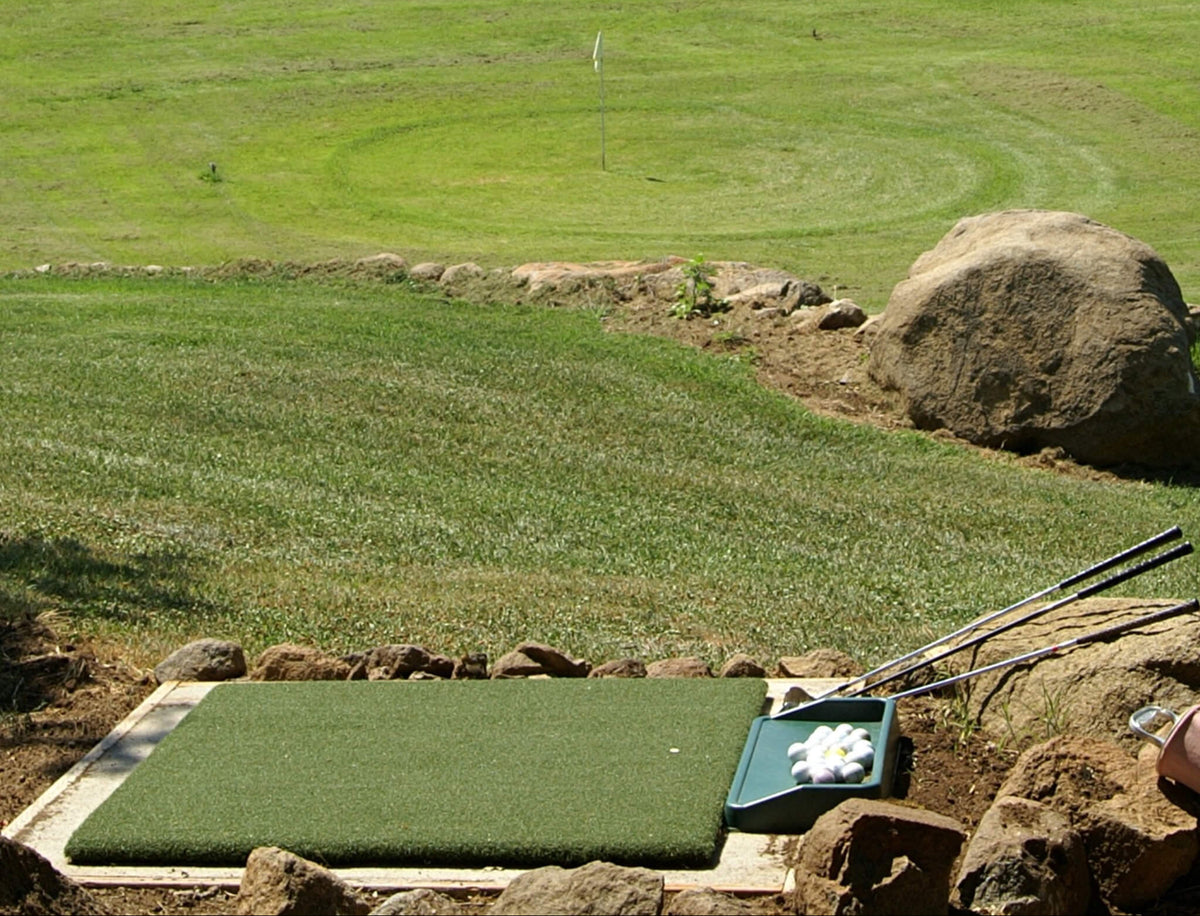 Country Club Elite 4x5 golf hitting mat positioned on an outdoor driving range. This realistic golf turf mat is ideal for commercial practice facilities or as a high-end golf simulator hitting mat