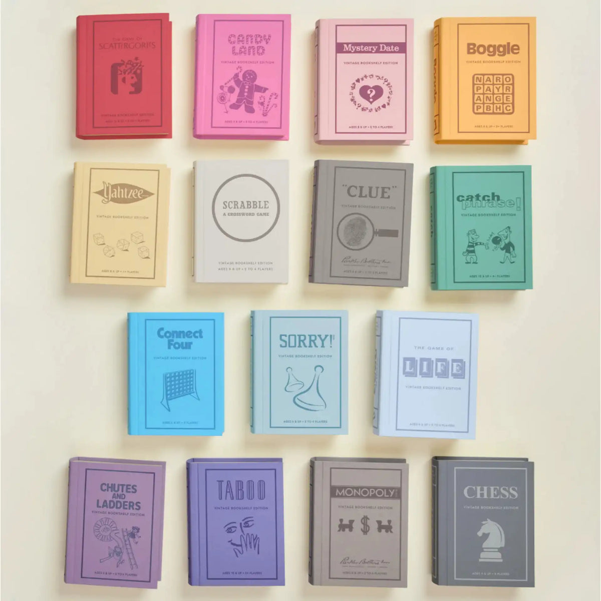 This is a flat lay of vintage board games designed as decorative board game books, showing Scattergories, Candy Land, Mystery Date, and Boggle in the top row, followed by Yahtzee, Scrabble, Clue, and Catch Phrase in the second row, Connect Four, Sorry, and The Game of Life in the third row, and Chutes and Ladders, Taboo, Monopoly, and Chess in the bottom row.